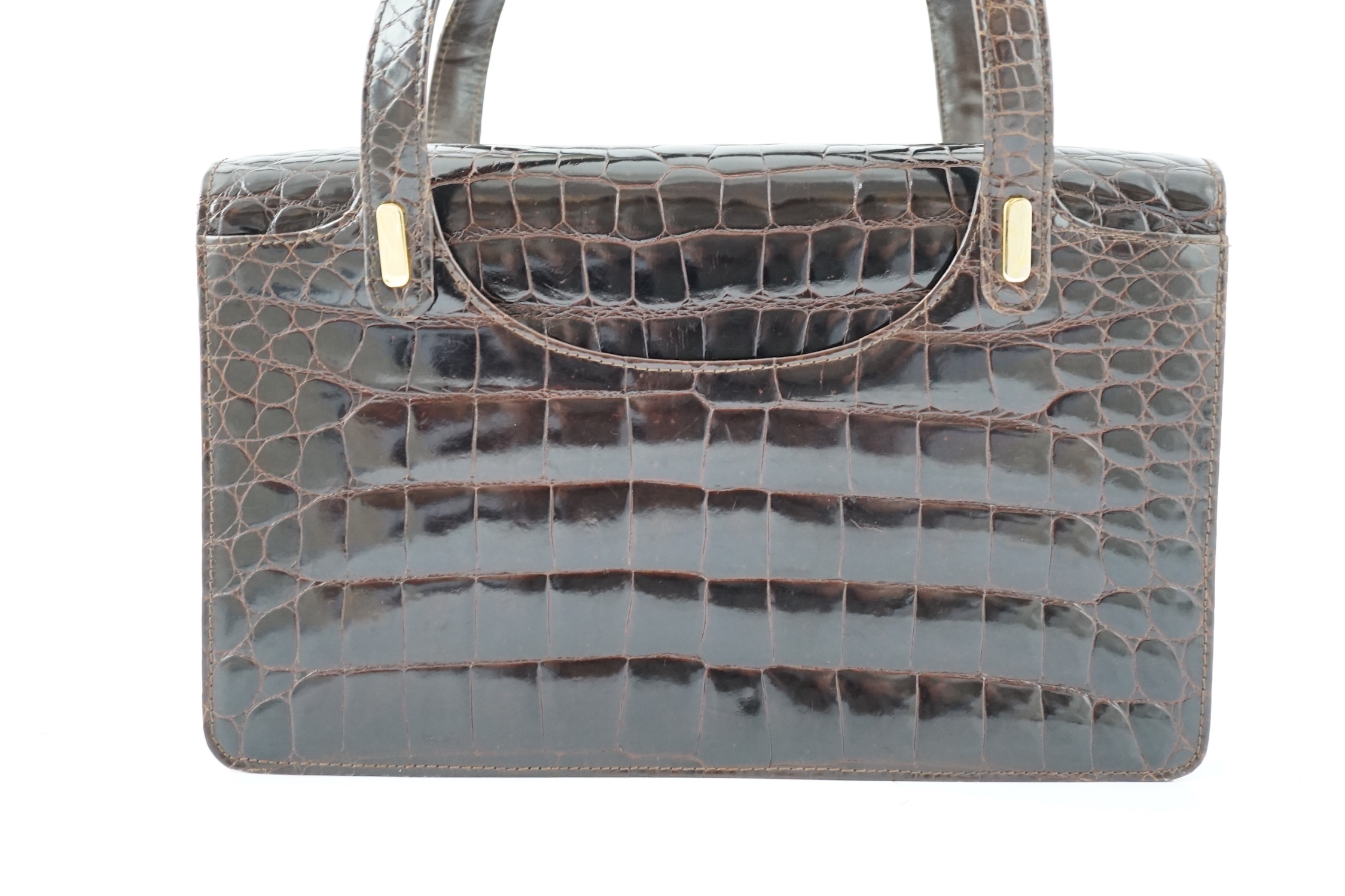 A lady's vintage brown crocodile handbag height 20cm, height to handles 33cm, width 32cm, depth 6cm